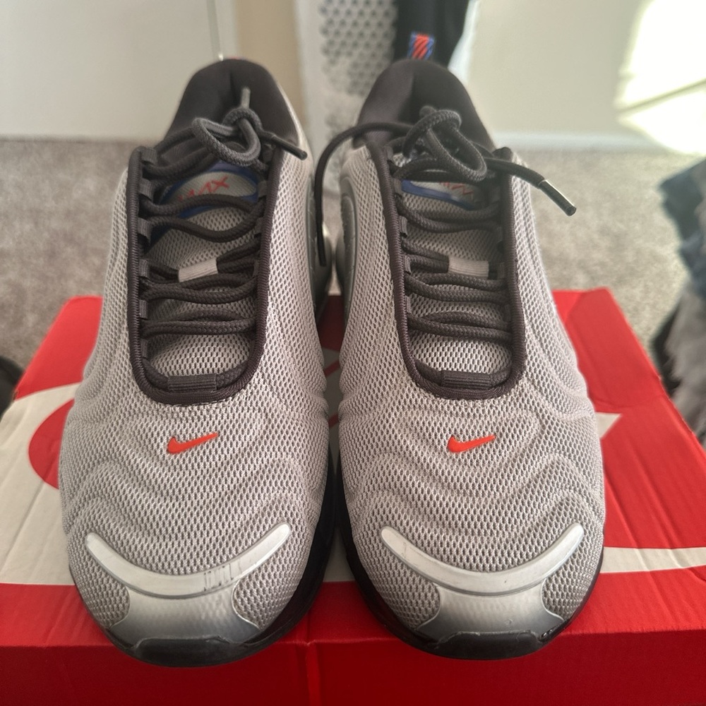 Grey, red and blue nike sneakers.